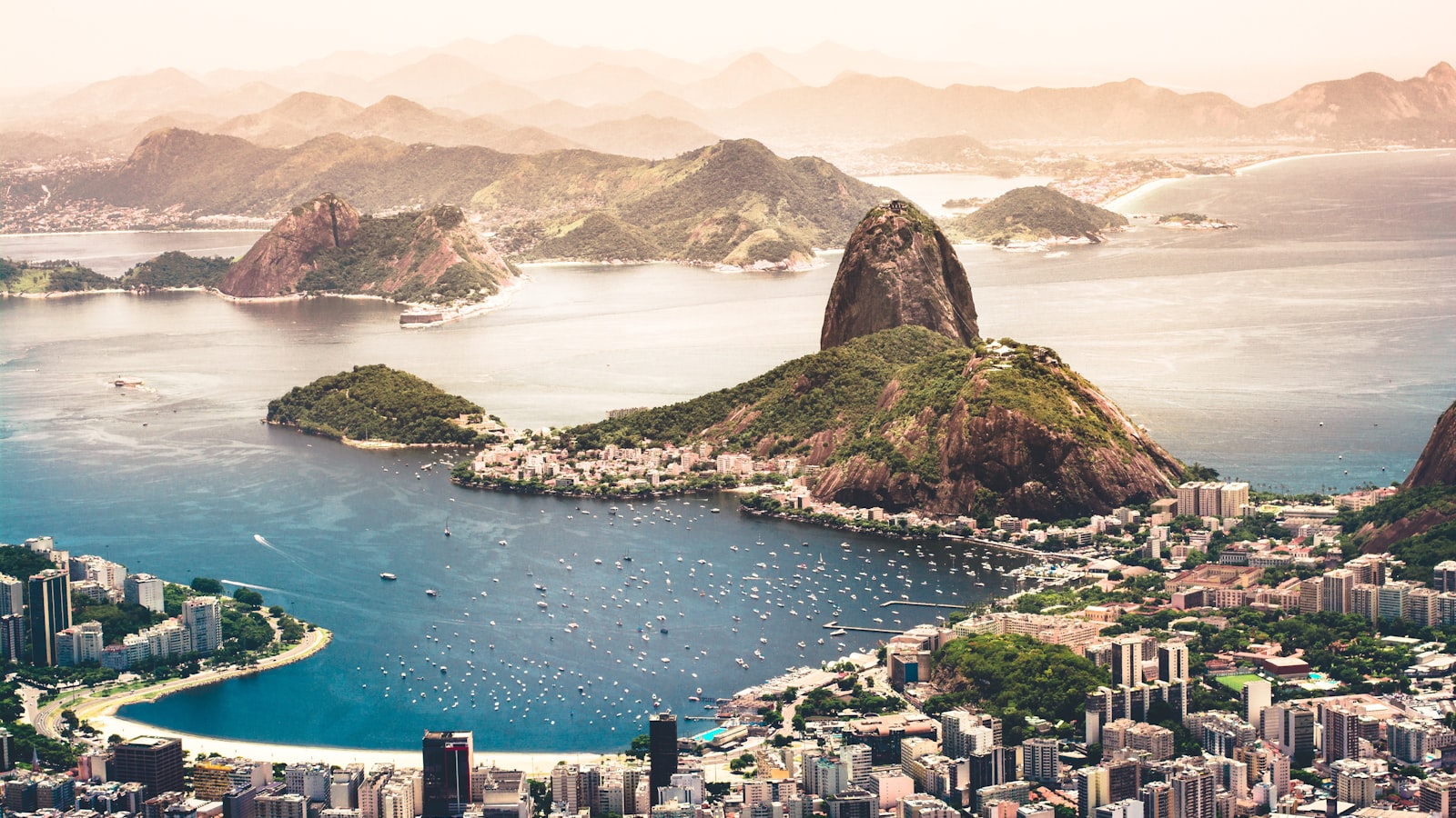 Christ the Redeemer statue overlooking Rio de Janeiro at sunset